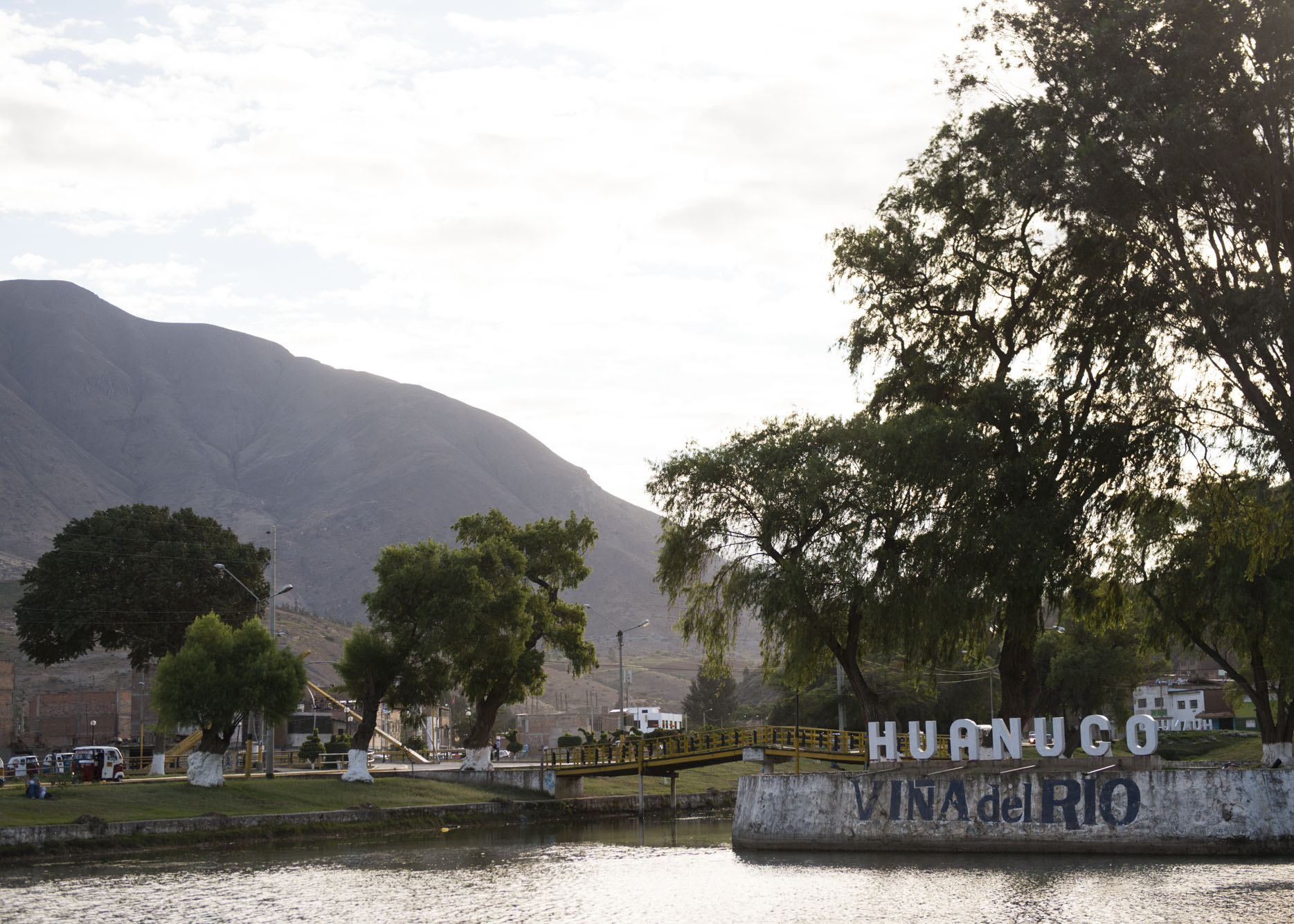 The Huanuco city sign over a river